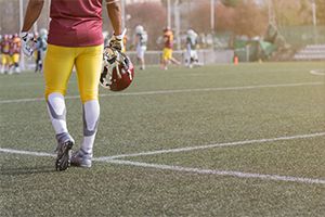 Football player holding his helmet