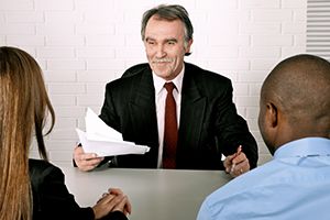 Two people meeting with a mediator