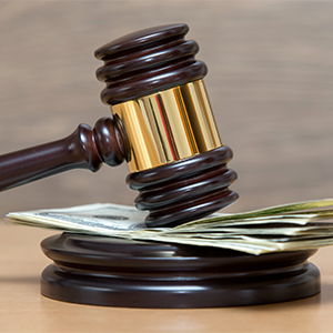 Gavel on a money on table