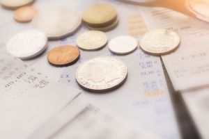 Coins on top of receipts