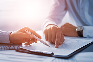 Business People Negotiating a Contract
