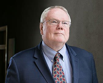 Headshot of attorney John McAvoy