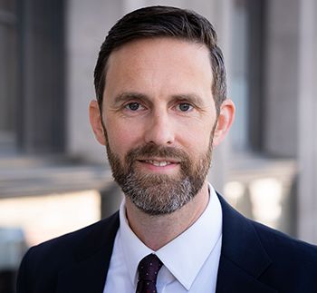 Bratt in a suit