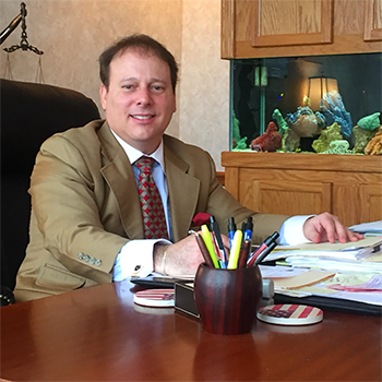 Malocu at his desk