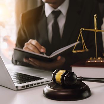 Attorney looking over his notes at his desk