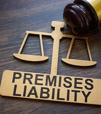 Plate with inscription Premises liability and gavel