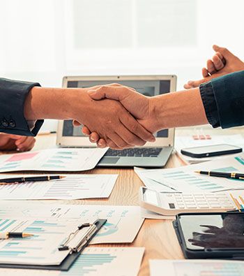 Businessmen shaking hand after agreement