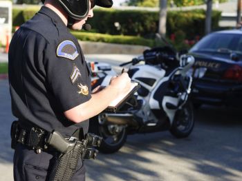 Officer writing a traffic ticket