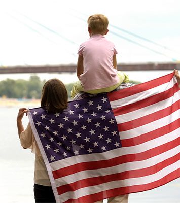 Family wrapped in American flag