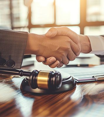 Lawyer shaking hands with client