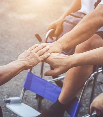 Disabled people putting their hand together