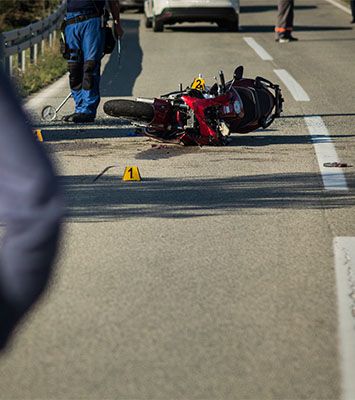 Crashed motorcycle on road