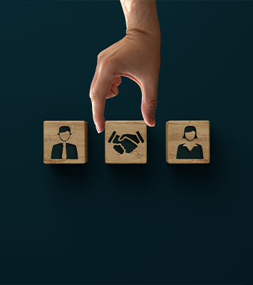 Wooden blocks with an icon of a man, woman and shaking hands with consent