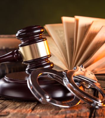 Gavel and Handcuff in table