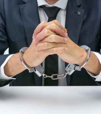 Businessman with handcuffs