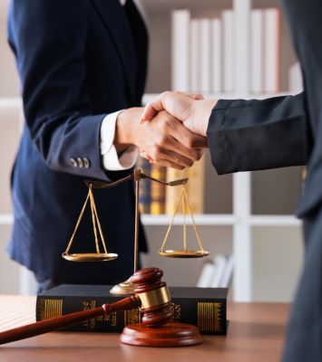Businessman shaking hands with attorney