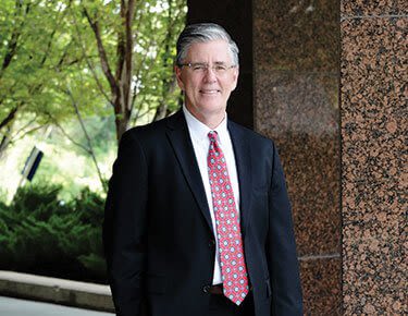 Attorney Charles Hyland standing outside