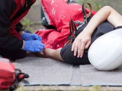 Worker Lying on the Ground with Injured Shoulder