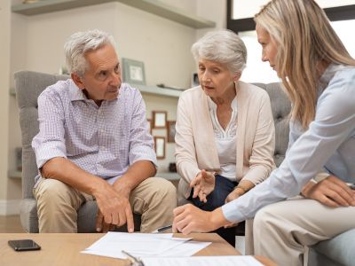 business agent planning with an older couple