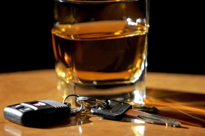 Car keys next to alcoholic drink