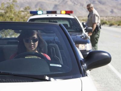 Woman getting pulled over by police officer