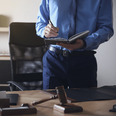 Businessman writing in a book