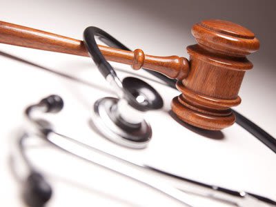 Stethoscope wrapped around a gavel
