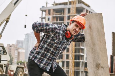 construction worker holding his back