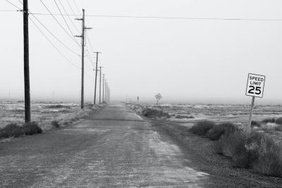 Empty dead road with a 25 mph speed limit