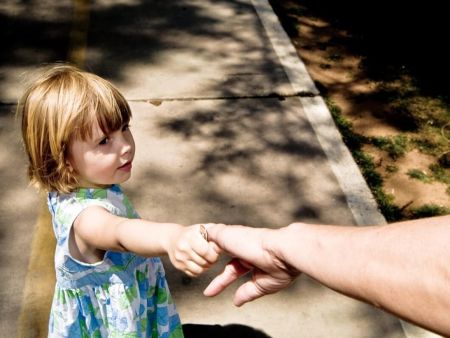 Little Girl Holding Adult's Hand