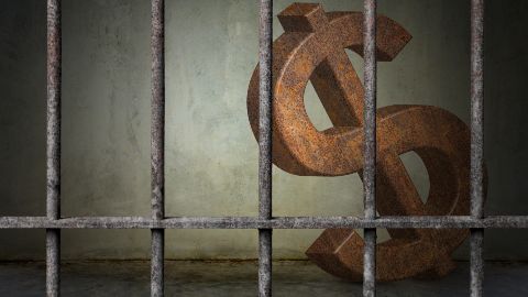 Dollar sign in a jail cell
