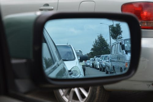 cars in a rearview mirror