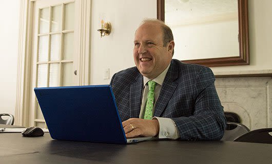 Attorney Harry Bernstein Working on a Laptop