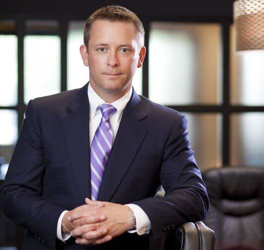 Attorney E. Ray Critchett Sitting in an Office
