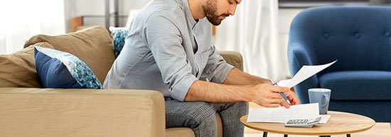 Man working on bankruptcy paperwork