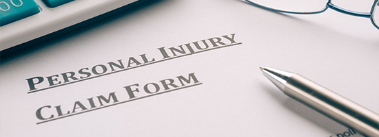 personal injury claim form on desk.