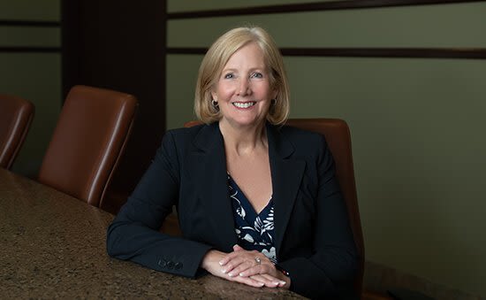 Attorney Tracy Tirey sitting at conference table