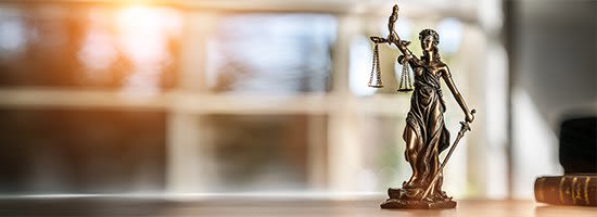 Bronze statue of Lady Justice on desk