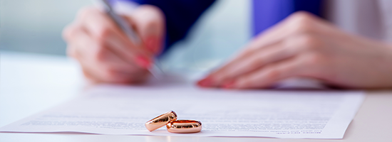 Woman signing prenuptial agreement in court