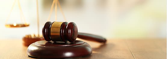 Wooden gavel and scales of justice