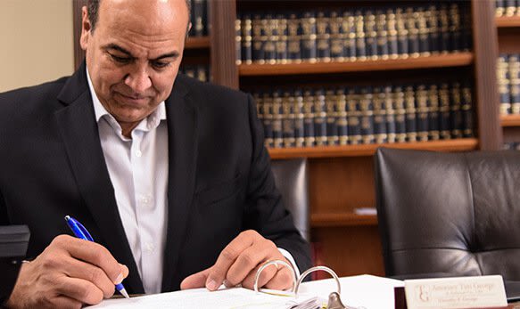 Attorney Tim George writing