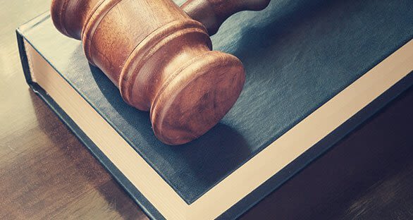 Gavel Resting On a Law Book