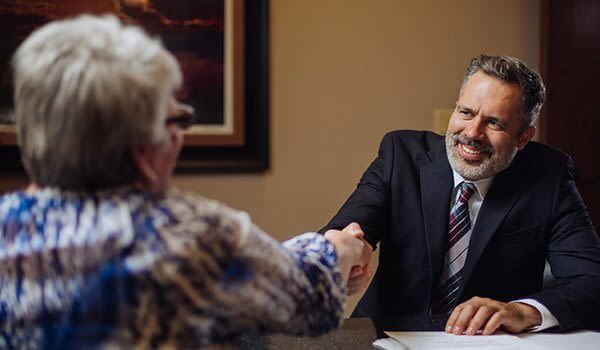 Attorney James R Nance Shakings Hands with a Client