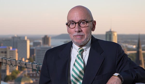 Attorney Laurence L. Pinkerton in front of Tulsa, Oklahoma skyline