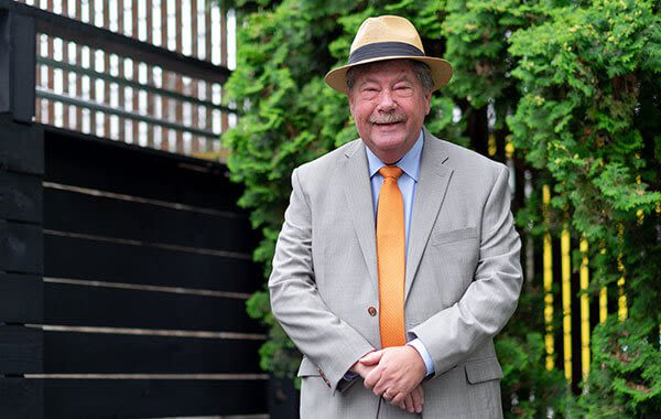 Attorney Mike Gillett outside a fance