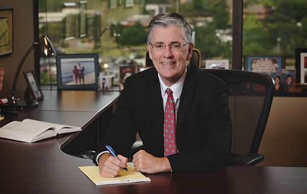 Attorney Charles Hyland siting at his desk