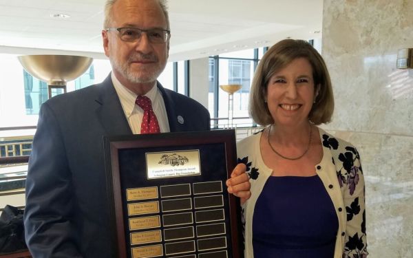 Mark Cummings with Award and Ilissa Belanger