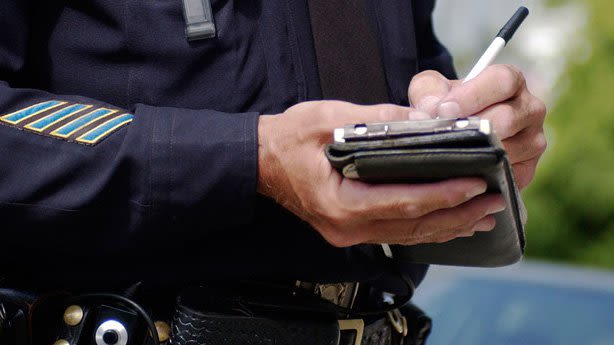 Cop writing citation