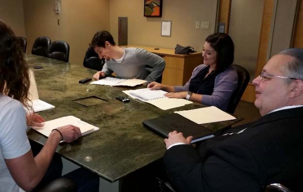 Williams in an office meeting