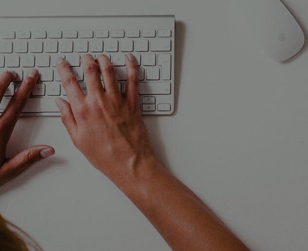 Hands typing on keyboard